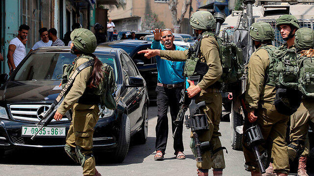 IDF troops near Azzun in the West Bank following the attack