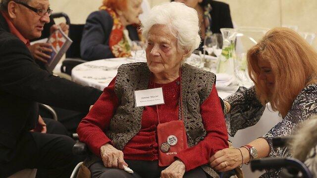 A participant listening to speeches during the event