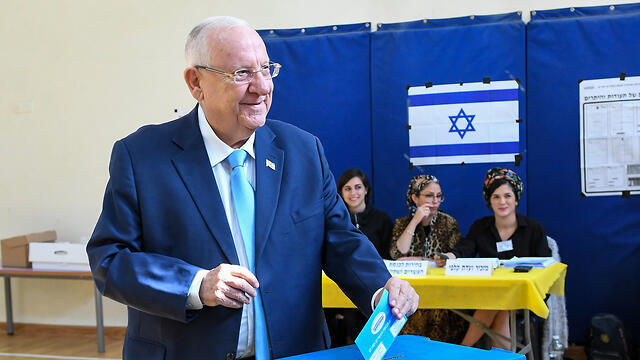 President Reuven Rivlin votes in Jerusalem in Tuesday's elections