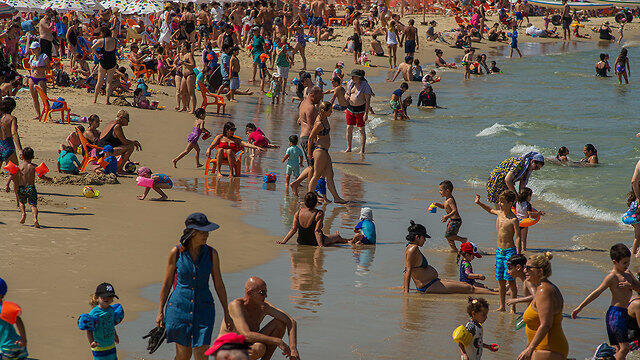 Israelis enjoying the last of the summer on Tel Aviv beach, September 2019