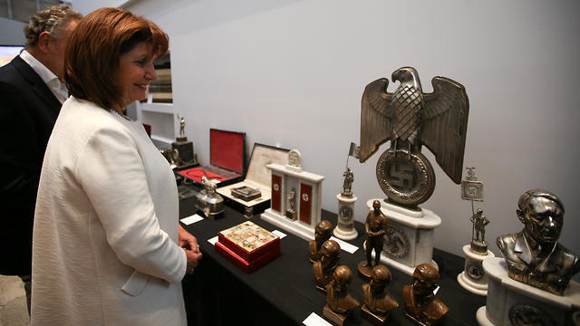 Argentine Security Minister Patricia Bullrich looks at Nazi artefacts before a news conference at the Holocaust museum in Buenos Aires