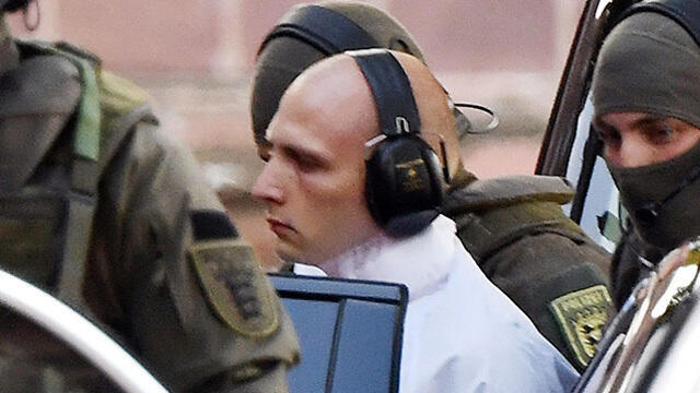 Убийца во время ареста. Фото: AFP