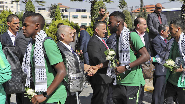 Members of the Palestine Football Federation welcome Saudi Arabia's national football team in Ramallah, Oct. 13, 2019 (Photo: AFP) Members of the Palestine Football Federation welcome Saudi Arabia's national football team in Ramallah, Oct. 13, 2019