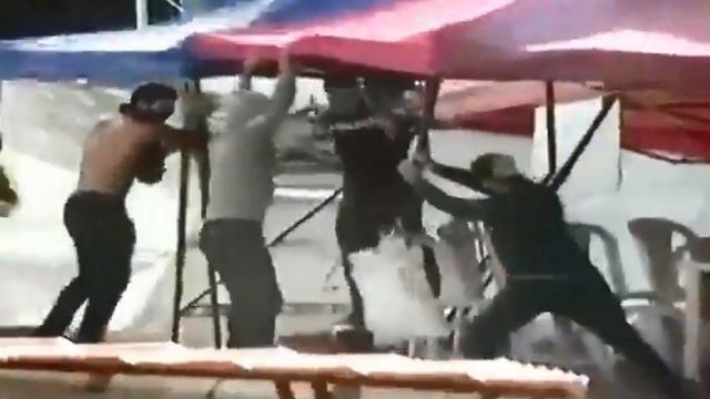 A still image taken from video showing Hezbollah members tearing down a protest tent in Beirutnullnull A still image taken from video showing Hezbollah members tearing down a protest tent in Beirut
