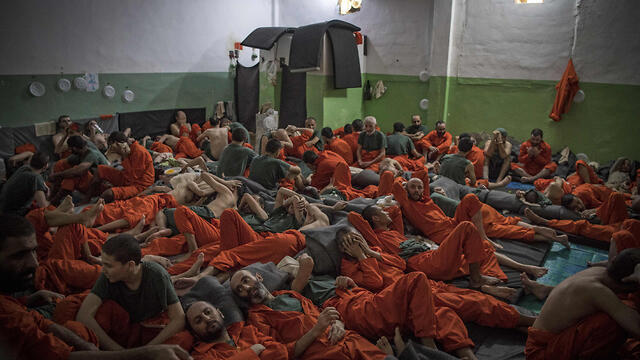 ISIS prisoners held in Kurdish prison (Photo: AFP) ISIS prisoners held in Kurdish prison