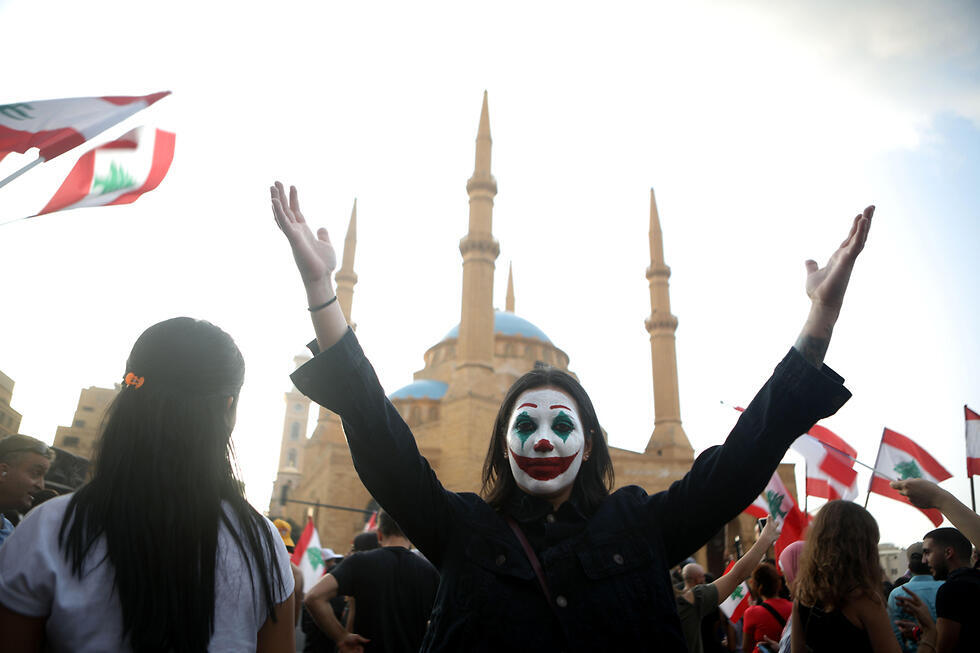 A protester in Beirut dressed as Joker 