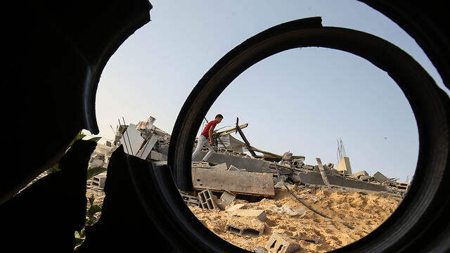 Buildings damaged by IDF strikes on Islamic Jihad targets in Gaza (Photo: AFP) (צילום: AFP) Buildings damaged by IDF strikes on Islamic Jihad targets in Gaza (Photo: AFP)