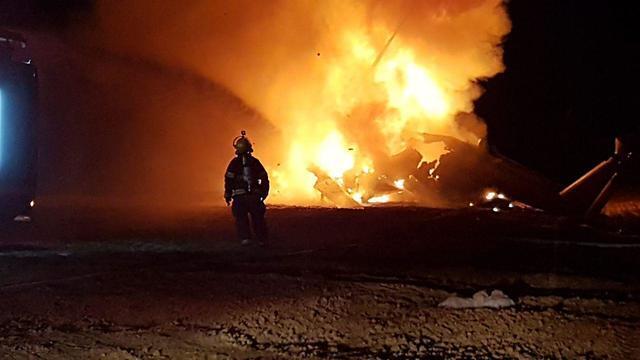 Вертолет объят огнем. Фото: пресс-служба Пожарной охраны