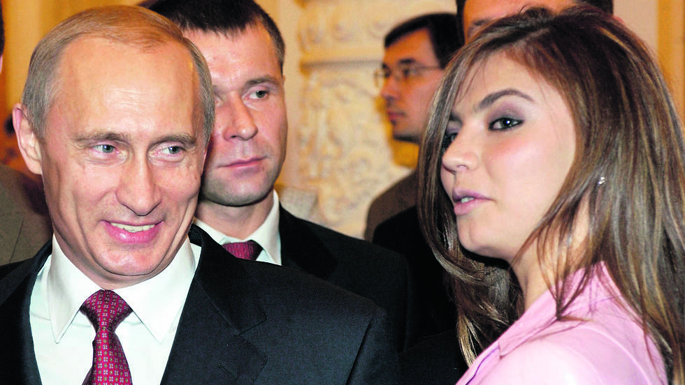 Alina Kabaeva and Vladimir Putin in a rare photograph together, taken years ago (Photo: AP) אלינה קבייבה וולדימיר פוטין
