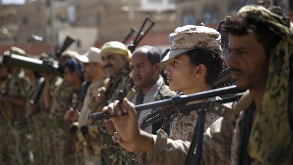  Houthi rebel fighters display their weapons during a gathering aimed at mobilizing more fighters for the Iranian-backed Houthi movement, in Sanaa, Yemen.