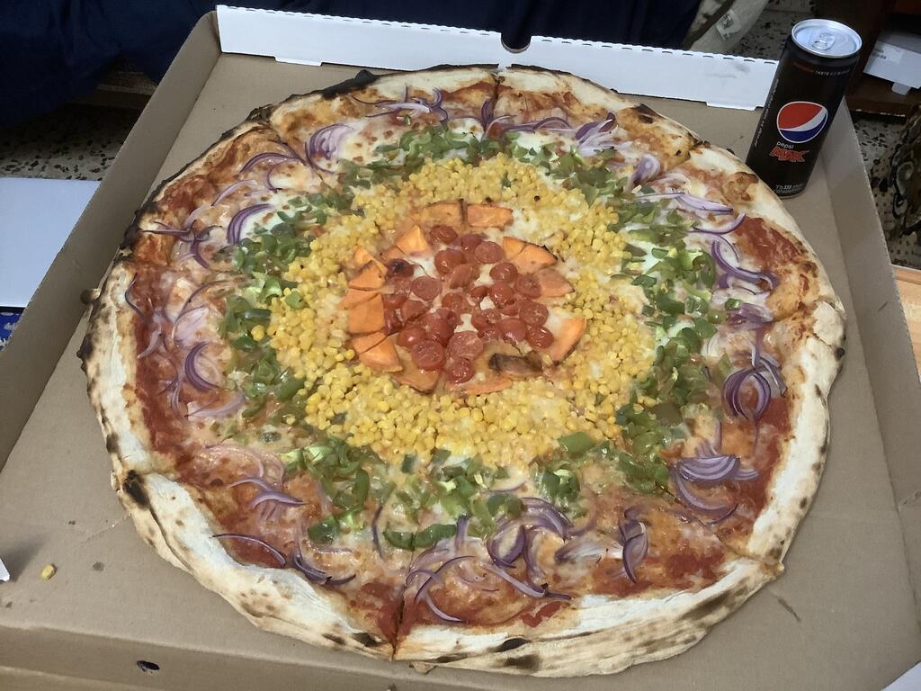 Pride Pizza, featuring vegetables in the colors of the rainbow flag, from PizzaPil in Tel Aviv 