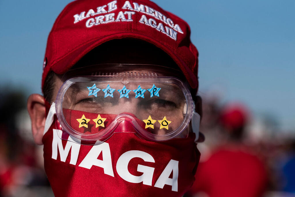 Photo: gettyimages תומך טראמפ עם הסיסמה MAGA בעצרת בחירות ב אוהיו