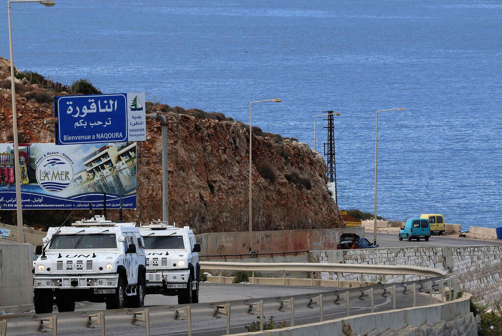 United Nations peacekeeping force (UNIFIL) vehicles patrol the coastal road to Naqura, the southernmost Lebanese town by the border with Israel,