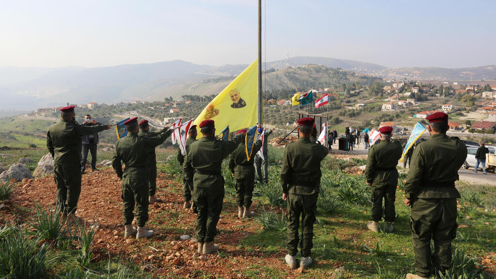 Hezbollah members attend a ceremony honoring Qassem Soleimani and Abu Mahdi al-Muhandis in a Lebanese village (Photo: Reuters) טקס של אנשי חיזבאללה ל קאסם סולימאני ואבו מהדי אל מוהנדס כפר ב לבנון