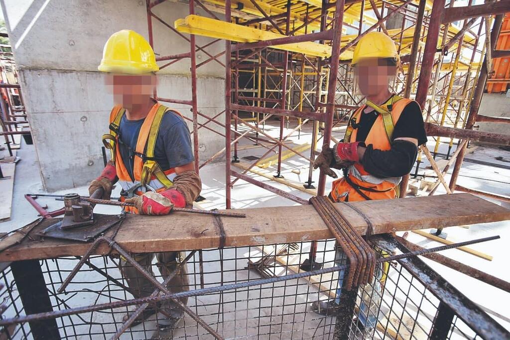 מהגרי עבודה באתר בניה