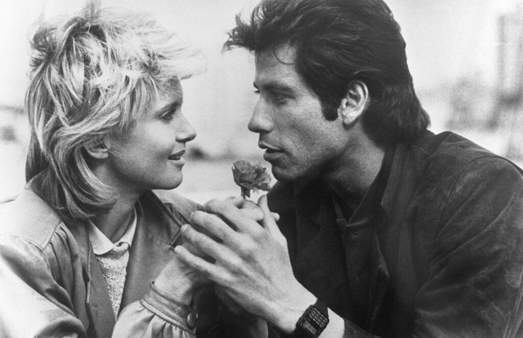 Olivia Newton-John and John Travolta on the set of <i>Two of a Kind</i> (Photo: AFP) אוליביה ניוטון ג'ון וג'ון טרבולטה על הסט של "צמד חמד"