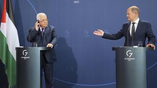 German Chancellor Olaf Scholz, right, and Mahmoud Abbas, President of the Palestinian Authority, answer questions from journalists at a press conference after their talks in Berlin, Germany 