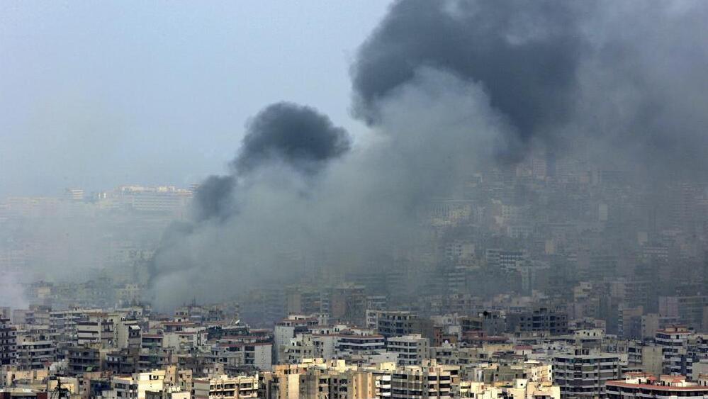 Black smoke rises from the demolished headquarters of Hezbollah in the suburbs of Beirut, Lebanon, following Israeli air strikes, July 16, 2006 (Photo: AP / Kevork Djansezian, File) Black smoke rises from the demolished headquarters of Hezbollah in the suburbs of Beirut, Lebanon, following Israeli air strikes, July 16, 2006