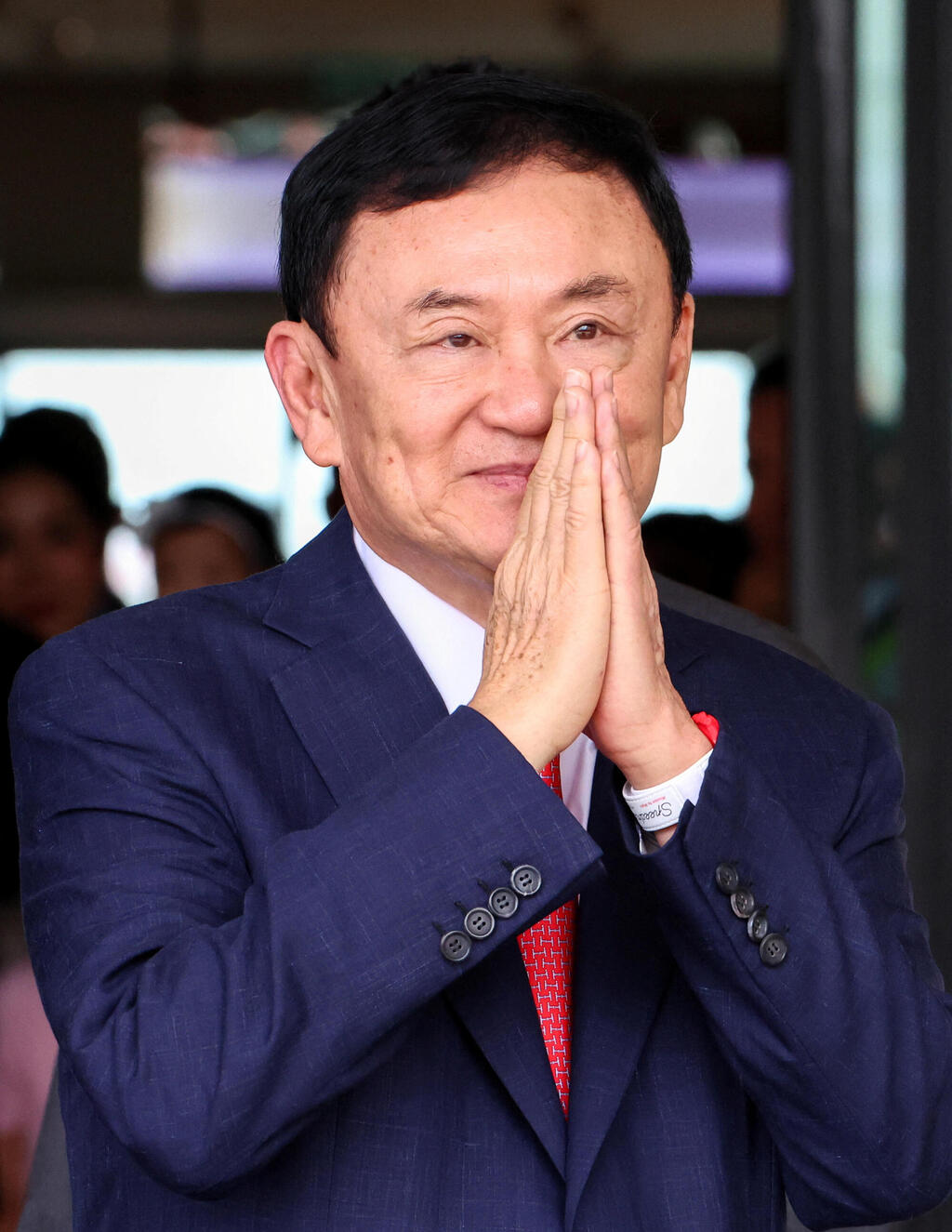 Thaksin Shinawatra, a media tycoon turned Thai prime minister in 2001 (Photo: Athit Perawongmetha/Reuters) טקסין צ'ינוואט ראש ממשלת תאילנד לשעבר אחרי נחיתתו ב בנגקוק אחירי 15 שנים בגלות
