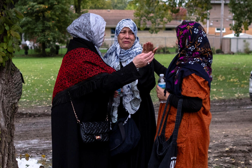Mourners arrive at Parkholm Cemetery to attend the burial of Wadea Al-Fayoume, 6, a Muslim boy who according to police was stabbed to death in an attack that targeted him and his mother for their religion