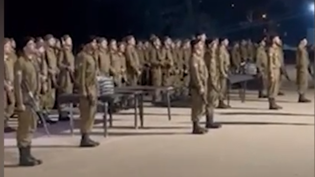 Haredi IDF recruits singing Israel's national anthem Hatikvah at basic training graduation ceremony