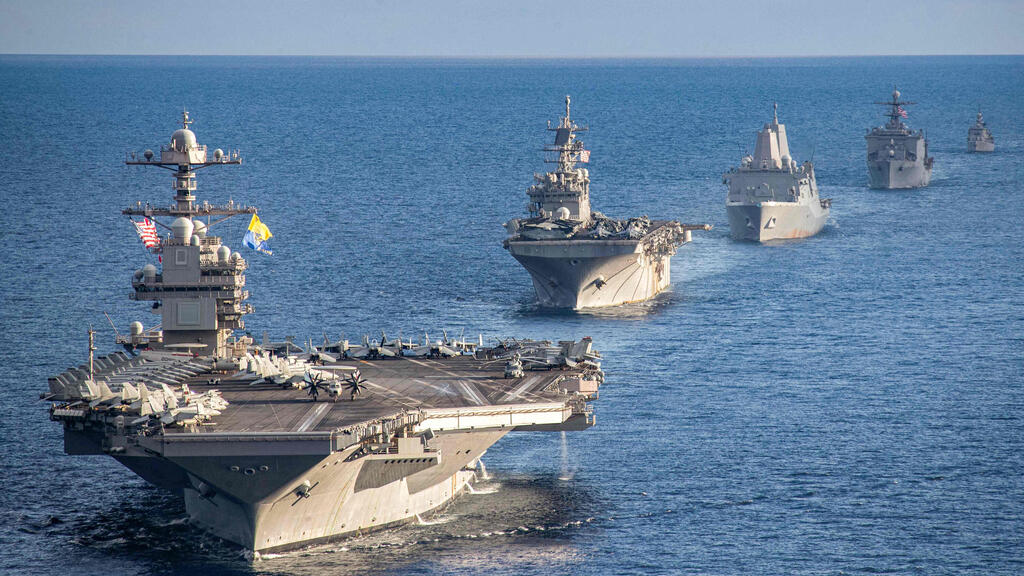 The USS Gerald R. Ford and its strike group (Photo: Maxwell Orlosky / US DEPARTMENT OF DEFENSE / AFP) נושאת המטוסים נושאת מטוסים ג'רלד פורד שטה עם ספינות מלחמה ספינה שמלוות אותה באזור הים התיכון ב-31 בדצמבר בצל ההחלטה האמריקנית להוציא אותה מהאזור ולהחזירה ל ארה"ב