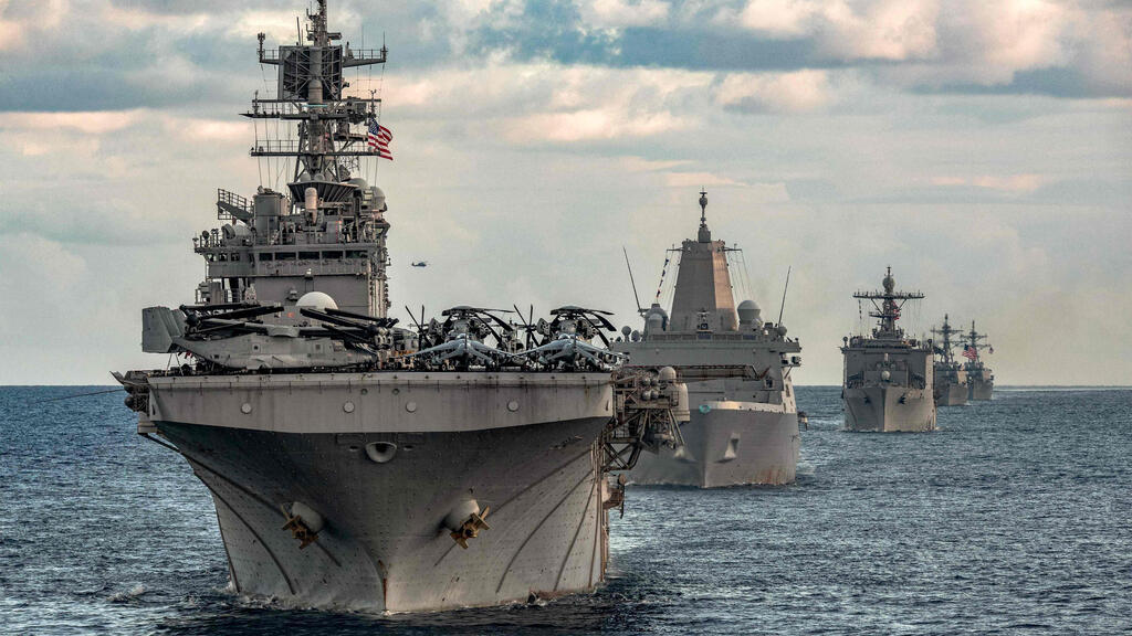 the aircraft carrier USS Gerald R. Ford and its strike group (Photo: Nolan PENNINGTON / US DEPARTMENT OF DEFENSE / AFP) נושאת המטוסים נושאת מטוסים ג'רלד פורד שטה עם ספינות מלחמה ספינה שמלוות אותה באזור הים התיכון ב-31 בדצמבר בצל ההחלטה האמריקנית להוציא אותה מהאזור ולהחזירה ל ארה"ב