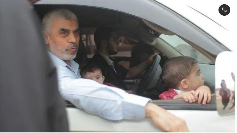Hamas leader Yahya Sinwar with two of his children 