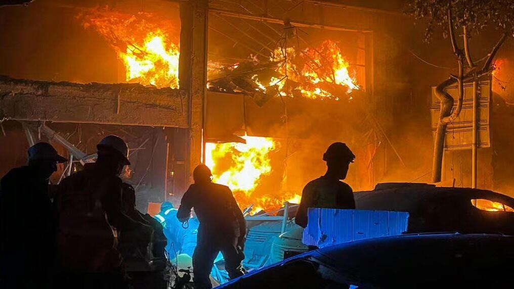 Firefighters try to contain the blaze in downtown Beirut