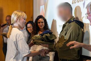 Ofek student receives her IDF uniform  in order to perform voluntary service