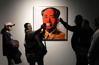 Iranians visit Mao Zedong painting by Andy Warhol at the Eye to Eye exhibition 
