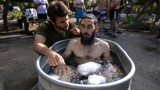 The volunteer Israeli rescue workers, whose role is to collect the remains of the dead, have begun attending group healing sessions 