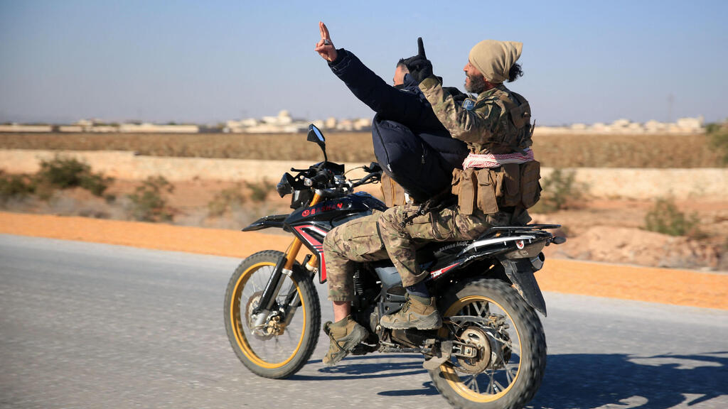 Rebel forces in Idlib (Photo: Aref Tammawi / AFP) חלב