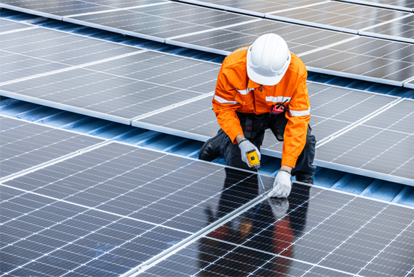 A person installs a solar panel