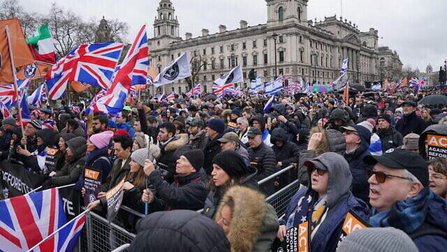 People in Parliament Square during a Campaign Against Antisemitism march and rally in central London