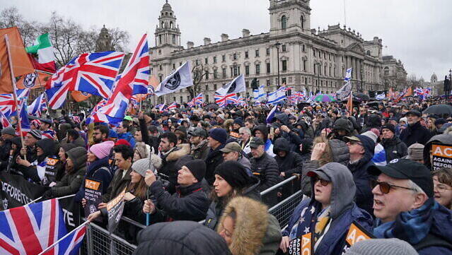 People in Parliament Square during a Campaign Against Antisemitism march and rally in central London