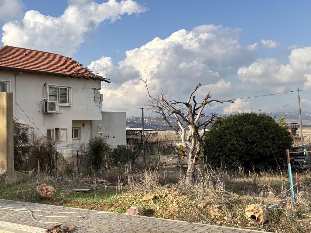 A home damaged by a rocket in Metula