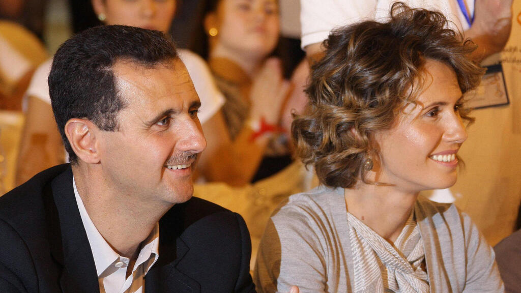 Bashar and Asma al-Assad (Photo: Louai BESHARA / AFP) אסמה אסד
