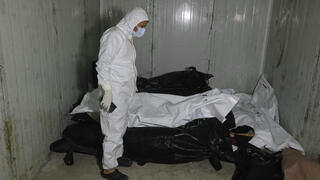 שקי גופות שעברו עינויים בית חולים בפרברי דמשק סוריה