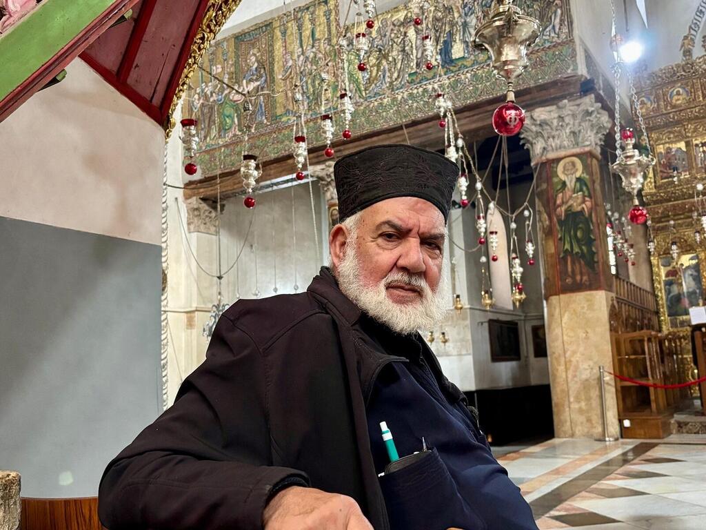 Father Spiridon Sammour in the Church of the Nativity in Bethlehem (Photo: Maayan Hoffman/The Media Line) Father Spiridon Sammour in the Church of the Nativity in Bethlehem