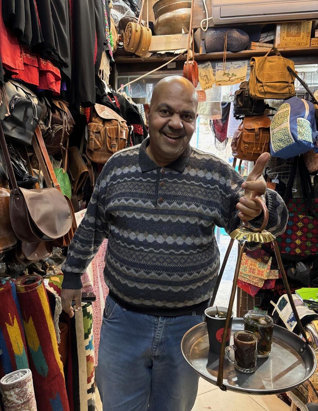 A Palestinian shop owner in Bethlehem, on the West Bank, serves tea and coffee; Many of the shops in Bethlehem are shuttered (Photo: Maayan Hoffman/The Media Line) A Palestinian shop owner in Bethlehem, on the West Bank, serves tea and coffee; Many of the shops in Bethlehem are shuttered