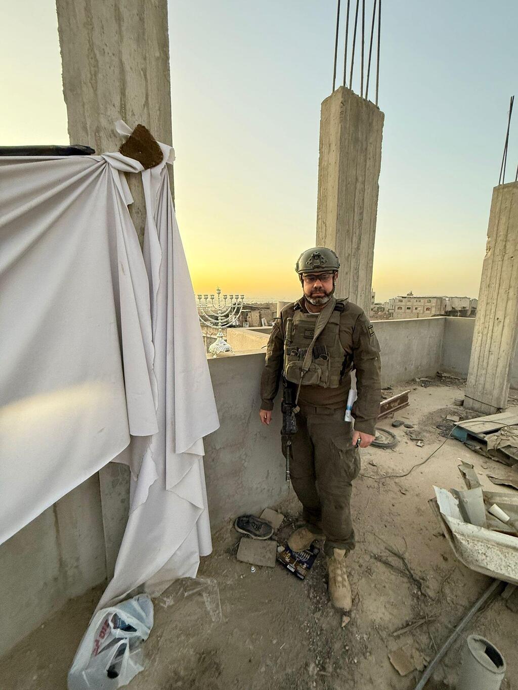 Moshiko Moskowitz lights a Hanukkah candle in Jabalia, Gaza (Courtesy) Moshiko Moskowitz lights a Hanukkah candle in Jabalia, Gaza