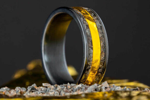 A one-of-a-kind ring with lunar meteorite fragments and insulation material from Apollo 11 (Photo: Honest Hands Ring Co., courtesy of John Mesick) A one-of-a-kind ring with lunar meteorite fragments and insulation material from Apollo 11