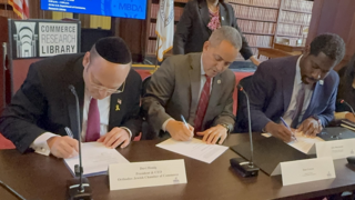 L-R: Honig, Graves, Morissette and Madiha sign the Memorandum of Understanding 