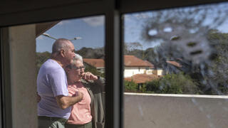 Pete and Gillian Brisley visit the home of their daughter, who was killed along with her two daughters in Hamas' Oct. 7 attack, and their son-in-law, who was taken captive, in Kibbutz Be'eri, southern Israel, Wednesday, Feb. 21, 2024 