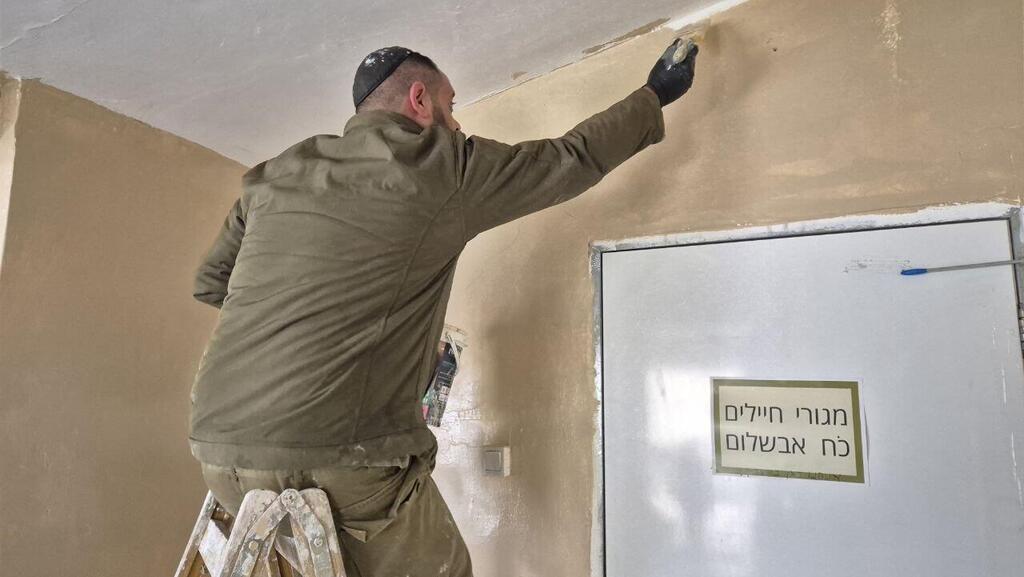 IDF troops renovating the kibbutz