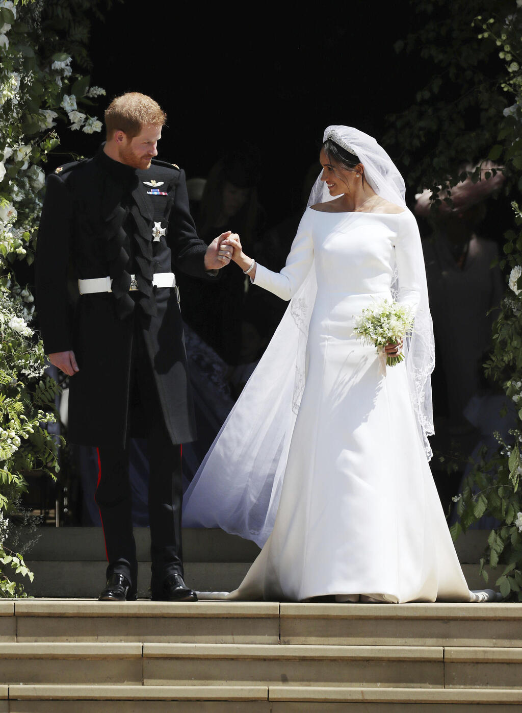 Prince Harry and Meghan Markle during their 2018 wedding (Photo: Jane Barlowpool photo via AP) מייגן מרקל והנסיך הארי בחתונתם, 2018