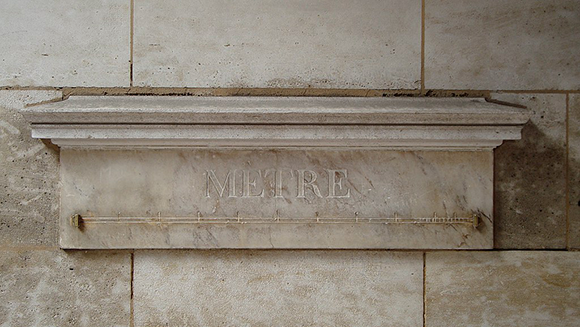 A standard meter on a wall in Paris