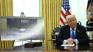 U.S. President Donald Trump with image of F-47 fighter jet