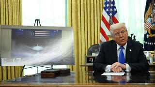 U.S. President Donald Trump with image of F-47 fighter jet